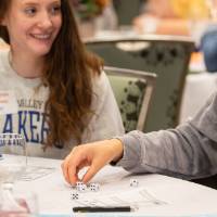 people playing games at luncheon table